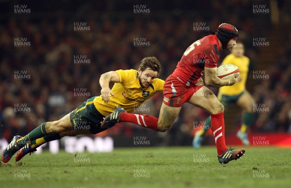 301113 - Wales v Australia, Dove Men Care Autumn Series - Leigh Halfpenny of Wales gets away from Mike Harris of Australia