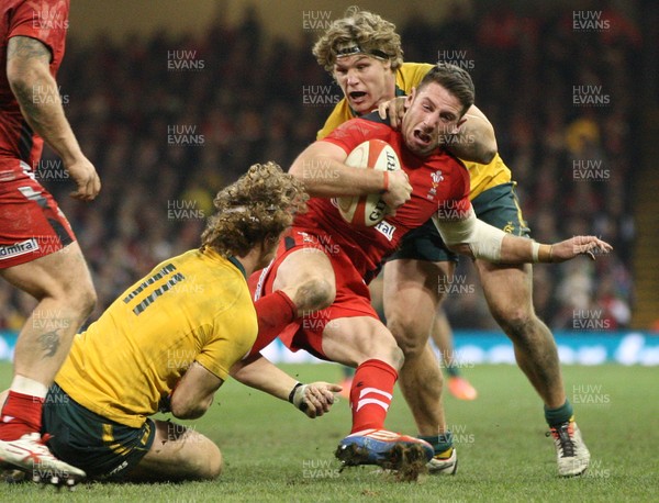 301113 - Wales v Australia, Dove Men Care Autumn Series - Alex Cuthbert of Wales is held by Nick Cummins of Australia and Michael Hooper of Australia