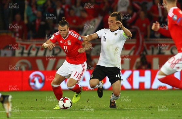 020917 - World Cup Qualifier -  European Group D - Wales v Austria - Gareth Bale of Wales takes on Julian Baumgartlinger of Austria