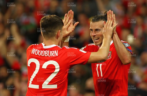 020917 - World Cup Qualifier -  European Group D - Wales v Austria - Ben Woodburn of Wales celebrates his goal with Gareth Bale