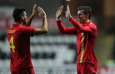 060213 - Wales v Austria, Vauxhall International Friendly Match, Swansea - Wales' Gareth Bale celebrates with Wales' Joe Ledley  after scoring goall 