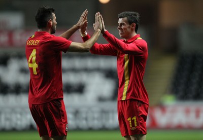 060213 - Wales v Austria, Vauxhall International Friendly Match, Swansea - Wales' Gareth Bale celebrates with Wales' Joe Ledley  after scoring goall 