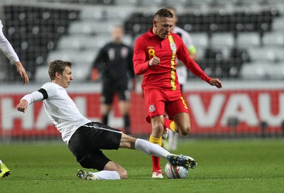 060213 - Wales v Austria, Vauxhall International Friendly Match, Swansea - Wales' Craig Bellamy avoids the challenge of Austria's Florian Klein