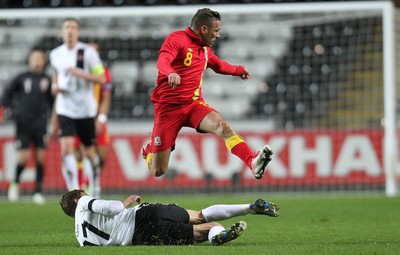 060213 - Wales v Austria, Vauxhall International Friendly Match, Swansea - Wales' Craig Bellamy avoids the challenge of Austria's Florian Klein
