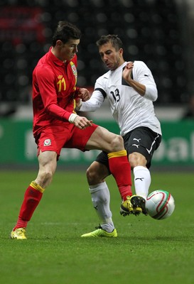 060213 - Wales v Austria, Vauxhall International Friendly Match, Swansea - Wales' Gareth Bale is challenged by Austria's Markus Suttner