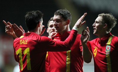 060213 - Wales v Austria, Vauxhall International Friendly Match, Swansea - Wales' Gareth Bale celebrates with Wales' Sam Vokes after Wales' second goal