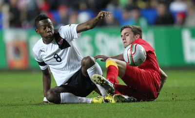 060213 - Wales v Austria, Vauxhall International Friendly Match, Swansea - Wales' Andrew King and Austria's David Alaba tangle as they go for the ball