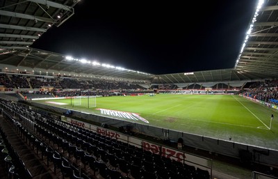 060213 - Wales v Austria - Vauxhall International Friendly Match - Swansea  -  Rows of empty seats greet the players as they line up for the national anthems