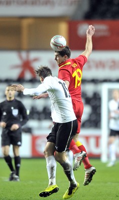 060213 - Wales v Austria - Vauxhall International Friendly Match - Swansea  -  Sam Vokes of Wales, wins the ball in the air against Austria's Veli Kavlak 
