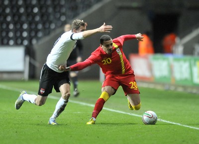 060213 - Wales v Austria - Vauxhall International Friendly Match - Swansea  -  Hal Robson-Kanu of Wales, right, holds off the challenge of Austria's Heinz Linder 