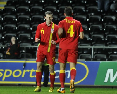 060213 - Wales v Austria - Vauxhall International Friendly Match - Swansea  -  Gareth Bale of Wales, left, celebrates his goal with team mate Joe Ledley 