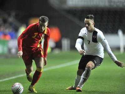 060213 - Wales v Austria - Vauxhall International Friendly Match - Swansea  -  Adam Matthews of Wales, left, takes on Austria's Marko Arnautovic 
