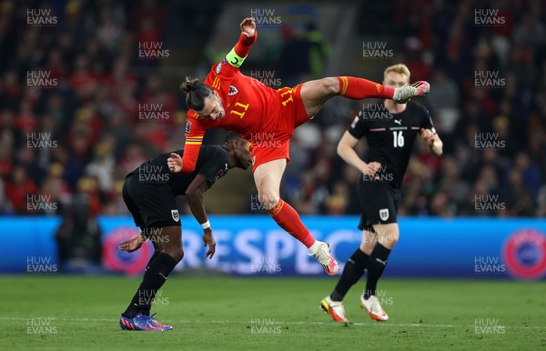 240322 - Wales v Austria - World Cup Qualifying - European - Path A - Gareth Bale of Wales is taken down by David Alaba of Austria