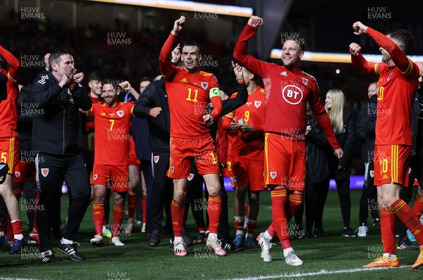 240322 - Wales v Austria - World Cup Qualifying - European - Path A - Gareth Bale celebrates alongside Chris Gunter of Wales at full time