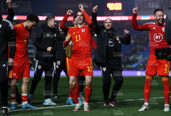 240322 - Wales v Austria - World Cup Qualifying - European - Path A - Gareth Bale and Wales Head Coach Rob Page celebrate at full time