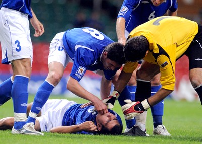 06.09.08 - World Cup 2010 Qualifying Wales v Azerbaijan Azerbaijan's Nodar Mamedov is helped by team-mates Djavid Huseinov and 'keeper Kamran Agayev after swallowing his toung 