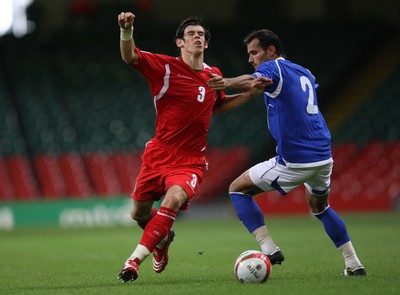 06.09.08... Wales v Azerbaijan, World Cup 2010 Qualifying Match, Cardiff  -  Wales' Gareth Bale is held by Azerbaijan's Rail Melikov 