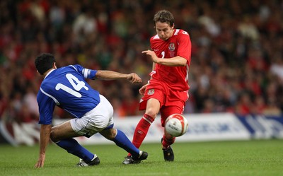 06.09.08... Wales v Azerbaijan, World Cup 2010 Qualifying Match, Cardiff  -  Wales' Chris Gunter is tackled by Azerbaijan's Rashad Sadikhov  