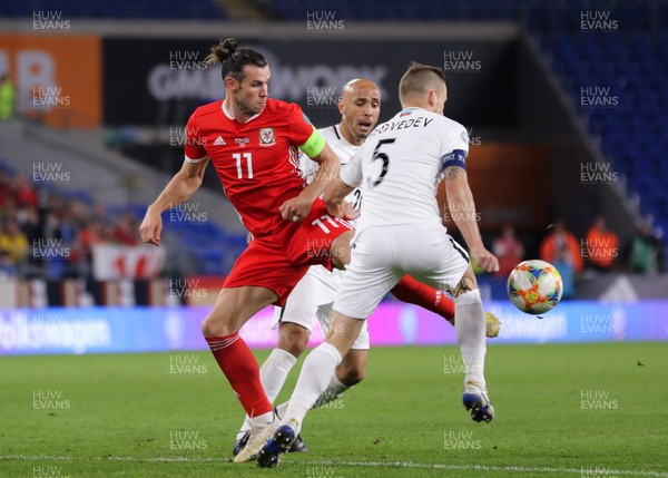 060919 - Wales v Azerbaijan, UEFA Euro 2020 Qualifier - Gareth Bale of Wales wins the ball from Maksim Medvedev of Azerbaijan