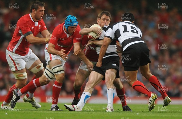 020612 - Wales v Barbarians - Powered by Under Armour -Shane Williams of Barbarians is tackled by Andrew Bishop of Wales