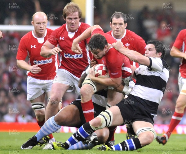 020612 - Wales v Barbarians - Powered by Under Armour - Ryan Jones of Wales, (left) is tackled by Isa Nacewa of Barbarians (unseen) and Francois Louw of Barbarians