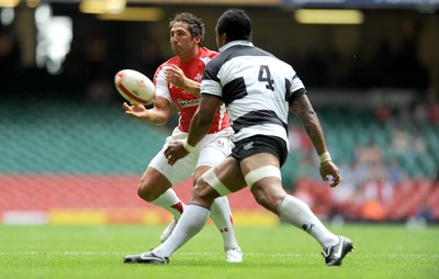 04.06.11 - Wales v Barbarians - DHL Challenge - Gavin Henson of Wales takes on Iosefa Tekori of Barbarians. 