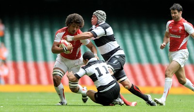 04.06.11 - Wales v Barbarians - DHL Challenge - Toby Faletau of Wales is tackled by Doug Howlett and Joe Van Niekerk of Barbarians. 