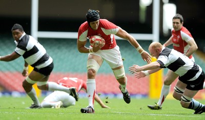 04.06.11 - Wales v Barbarians - DHL Challenge - Luke Charteris of Wales gets past Martyn Williams of Barbarians. 