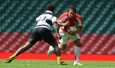 04.06.11 - Wales v Barbarians - DHL Challenge - Gavin Henson of Wales is tackled by Seru Rabeni of Barbarians. 