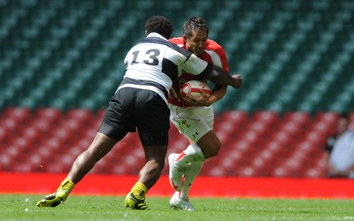 04.06.11 - Wales v Barbarians - DHL Challenge - Gavin Henson of Wales is tackled by Seru Rabeni of Barbarians. 