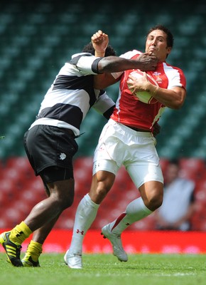 04.06.11 - Wales v Barbarians - DHL Challenge - Gavin Henson of Wales is tackled by Seru Rabeni of Barbarians. 