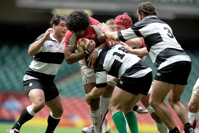 04.06.11 - Wales v Barbarians - DHL Challenge - Toby Faletau of Wales is tackled by George Smith, Leonardo Ghiraldini and Carl Hayman of Barbarians. 