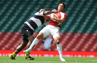 04.06.11 - Wales v Barbarians - DHL Challenge - Gavin Henson of Wales is tackled by Seru Rabeni of Barbarians. 
