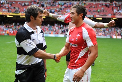 04.06.11 - Wales v Barbarians - DHL Challenge - Gavin Henson of Wales and Brock James of Barbarians at the end of the game. 