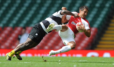 04.06.11 - Wales v Barbarians - DHL Challenge - Gavin Henson of Wales is tackled by Seru Rabeni of Barbarians. 