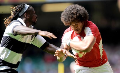04.06.11 - Wales v Barbarians - DHL Challenge - Toby Faletau of Wales takes on Paul Sackey of Barbarians. 