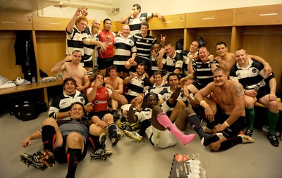 04.06.11 - Wales v Barbarians - DHL Challenge - Barbarians players celebrate with the winners trophy in the changing rooms. 