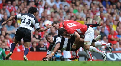 04.06.11 - Wales v Barbarians - DHL Challenge - Willie Mason of Barbarians is tackled by George North and Josh Turnbull of Wales. 