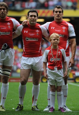 04.06.11 - Wales v Barbarians - DHL Challenge - Ryan Jones, Stephen Jones and Sam Warburton of Wales line up for the national anthems with match mascot Thomas Hughes. 