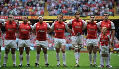04.06.11 - Wales v Barbarians - DHL Challenge - Paul James, Huw Bennett, Ryan Bevington, Jonathan Davies, Ryan Jones, Stephen Jones and Sam Warburton of Wales line up for the national anthems with match mascot Thomas Hughes. 