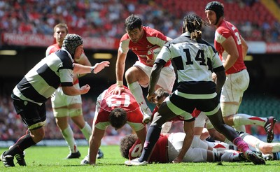04.06.11 - Wales v Barbarians - DHL Challenge - Mike Phillips of Wales drives through. 