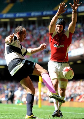 04.06.11 - Wales v Barbarians - DHL Challenge - Sergio Parisse of Barbarians tries to clear past Luke Charteris of Wales. 