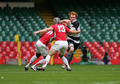 04.06.11 Wales v The Barbarians - DHL Challenge WRU 130th Anniversary Match - Barbarians' Paul Tito is tackled by Wales' Aled Brew(11) & Johnathan Davies.  