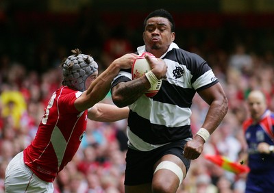 04.06.11 Wales v The Barbarians - DHL Challenge WRU 130th Anniversary Match - Barbarians' Iosefa Tekori powers through Wales' Johnathan Davies to score.  