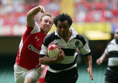 04.06.11 Wales v The Barbarians - DHL Challenge WRU 130th Anniversary Match - Barbarians' Isa Nacewa races in to score despite Wales' Morgan Stoddart giving chase. 