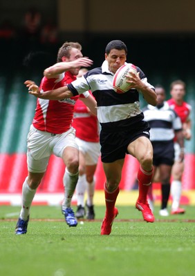 04.06.11 Wales v The Barbarians - DHL Challenge WRU 130th Anniversary Match - Barbarians' Doug Howlett is tackled by Wales' Morgan Stoddart. 