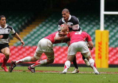 04.06.11 Wales v The Barbarians - DHL Challenge WRU 130th Anniversary Match - Barbarians' Willie Mason is tackled by Wales' Luke Charteris(L) & Paul James.  