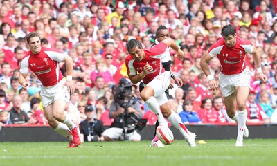 04.06.11 Wales v Barbarians... Wales' Gavin Henson gets past Mathieu Bastareaud of Barbarians. 