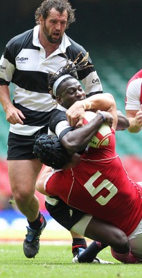 04.06.11 Wales v Barbarians... Paul Sackey of Barbarians is tackled by Luke Charteris of Wales. 