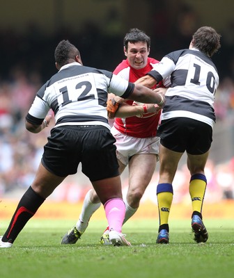 04.06.11 Wales v Barbarians... Stephen Jones takes on Mathieu Bastareaud of Barbarians and Brock James. 